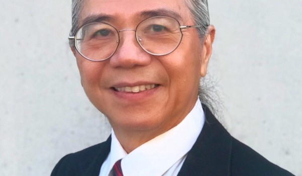 Headshot of Peter Bok, musician and music teacher, smiling.
