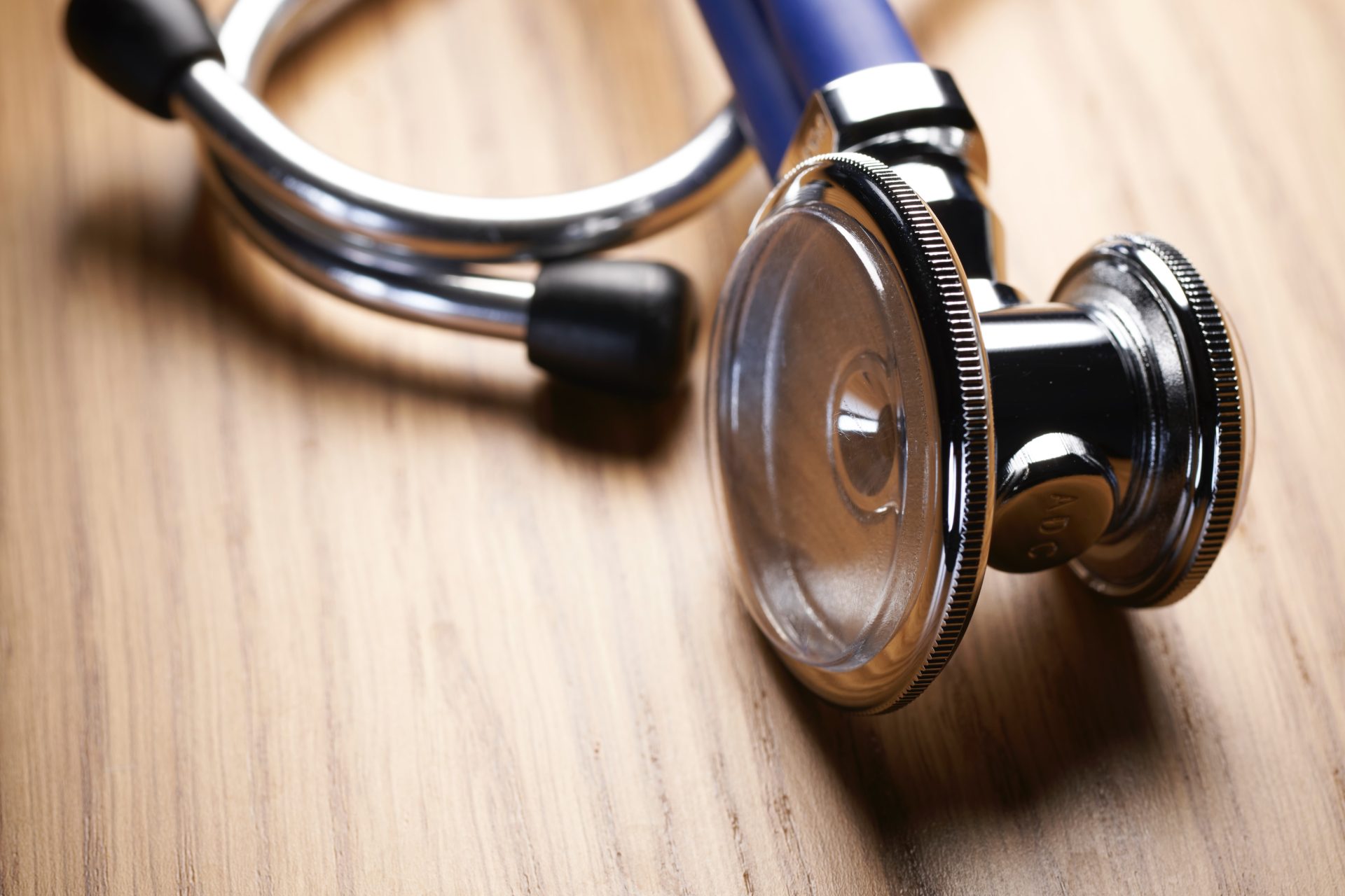 Jessica Evans on prison health as public health. Photo of stethoscope resting on tabletop.