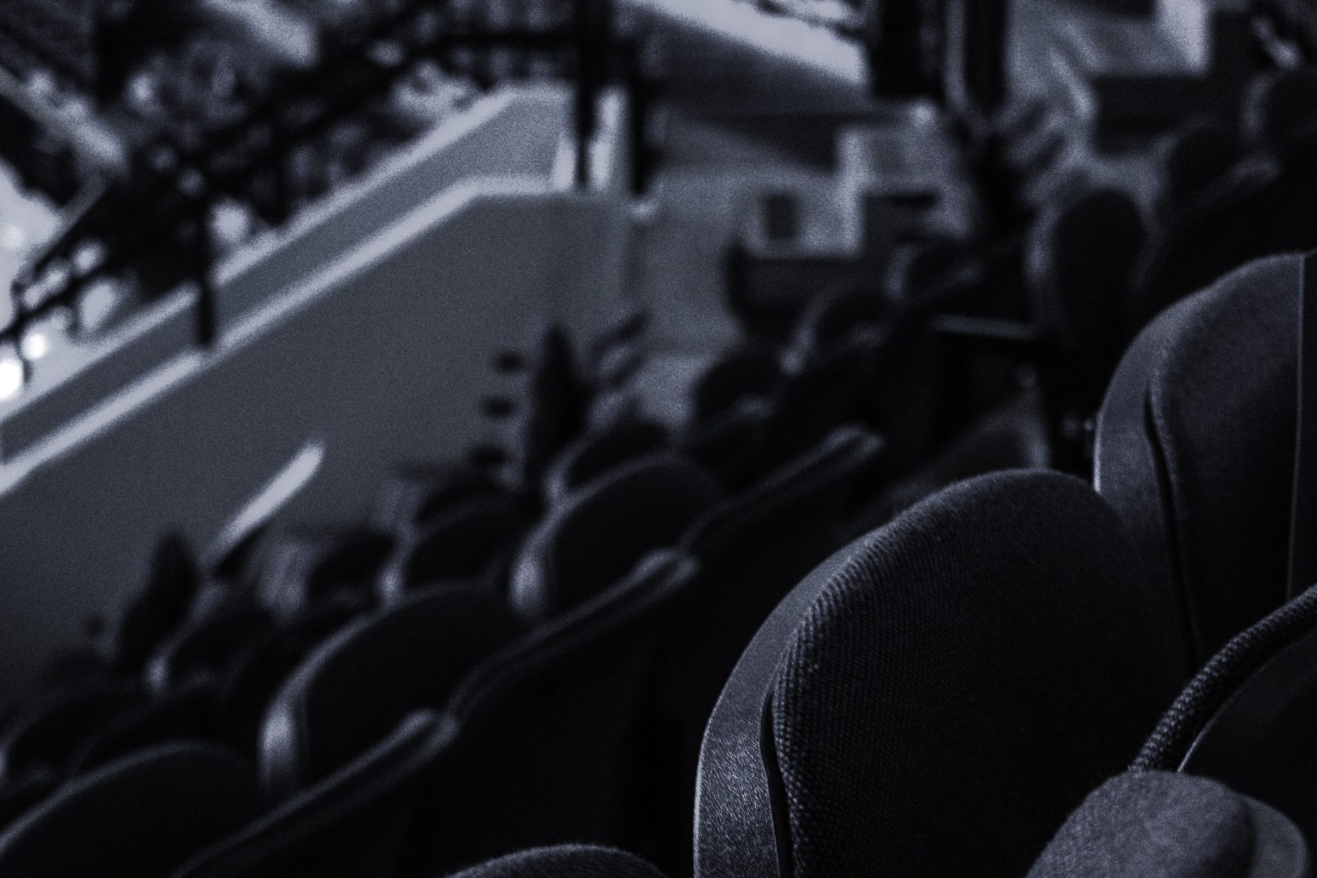 Why the NWHL Bubble burst. Black and white photo of empty hockey stadium.