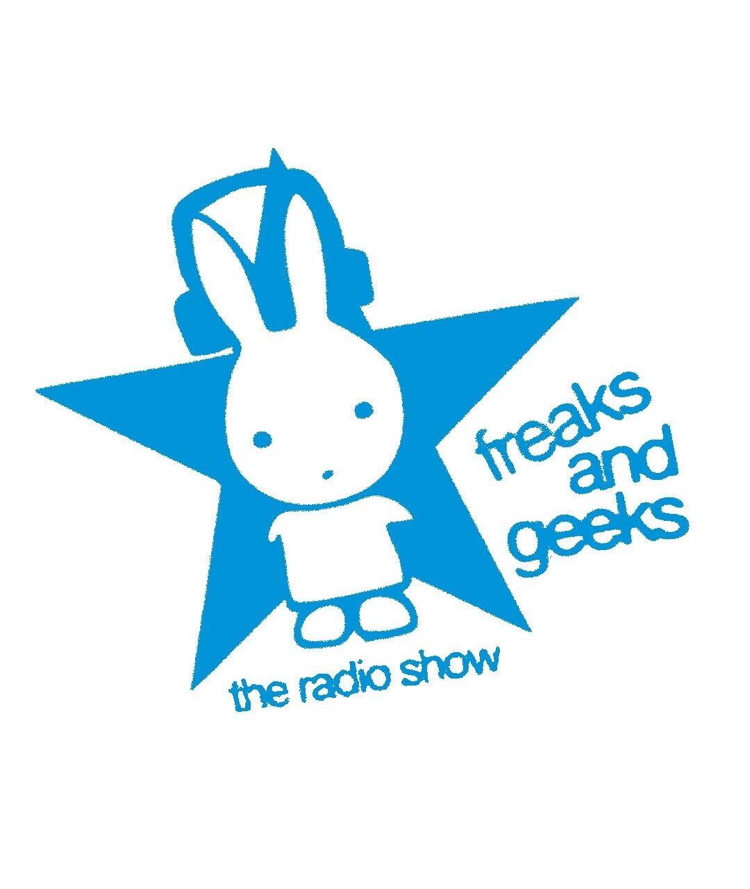 A 2-tone logo, containing a white bunny with headphones that appears to be wearing a t-shirt and shoes, standing in front of a blue 5-point star. The radio show title on the right side of the bunny and star, and "The Radio Show", written underneath. Set on a white background.